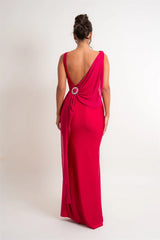 Close-up of rhinestone buckle detail on draped maxi dress