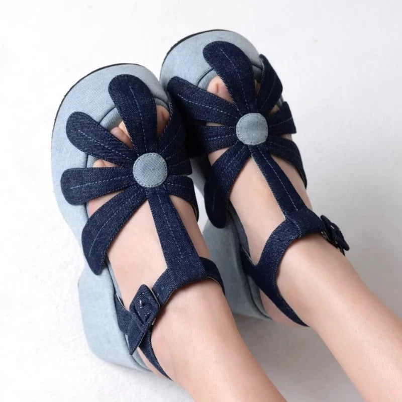 Denim platform sandals with flower detail and T-strap.
