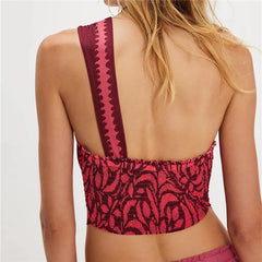 Back view of a floral print one shoulder crop top.