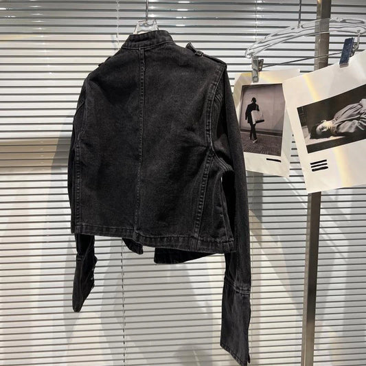 Back view of a black denim jacket with a stand-up collar and long sleeves.