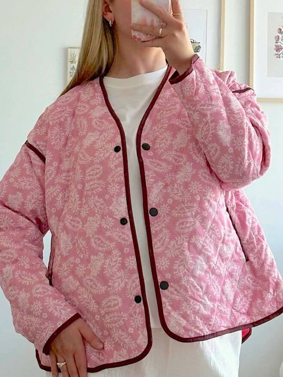 Quilted jacket with pink paisley print and dark contrast trim
