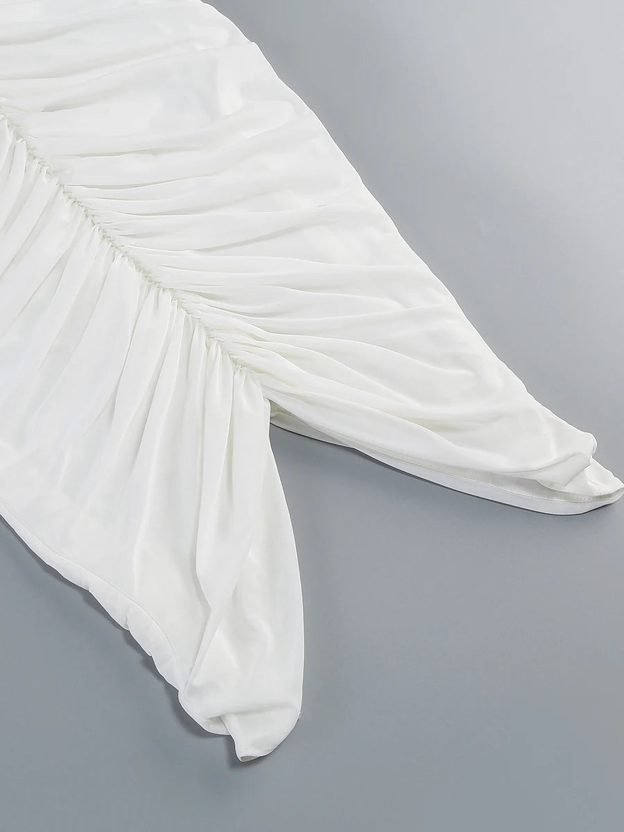 White fabric draped over a chair on a gray background