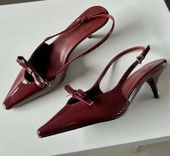  Pair of  pointed-toe slingback pumps with a buckle strap, showcasing their elegant design.  Red . Golden atelier 3