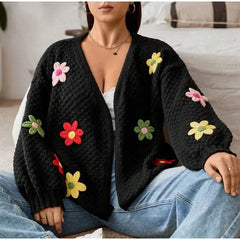 Detail of floral appliqu� on a black knit cardigan