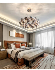  Modern crystal chandelier hanging above a Bed room , creating a sophisticated and elegant atmosphere. Golden Atelier 3