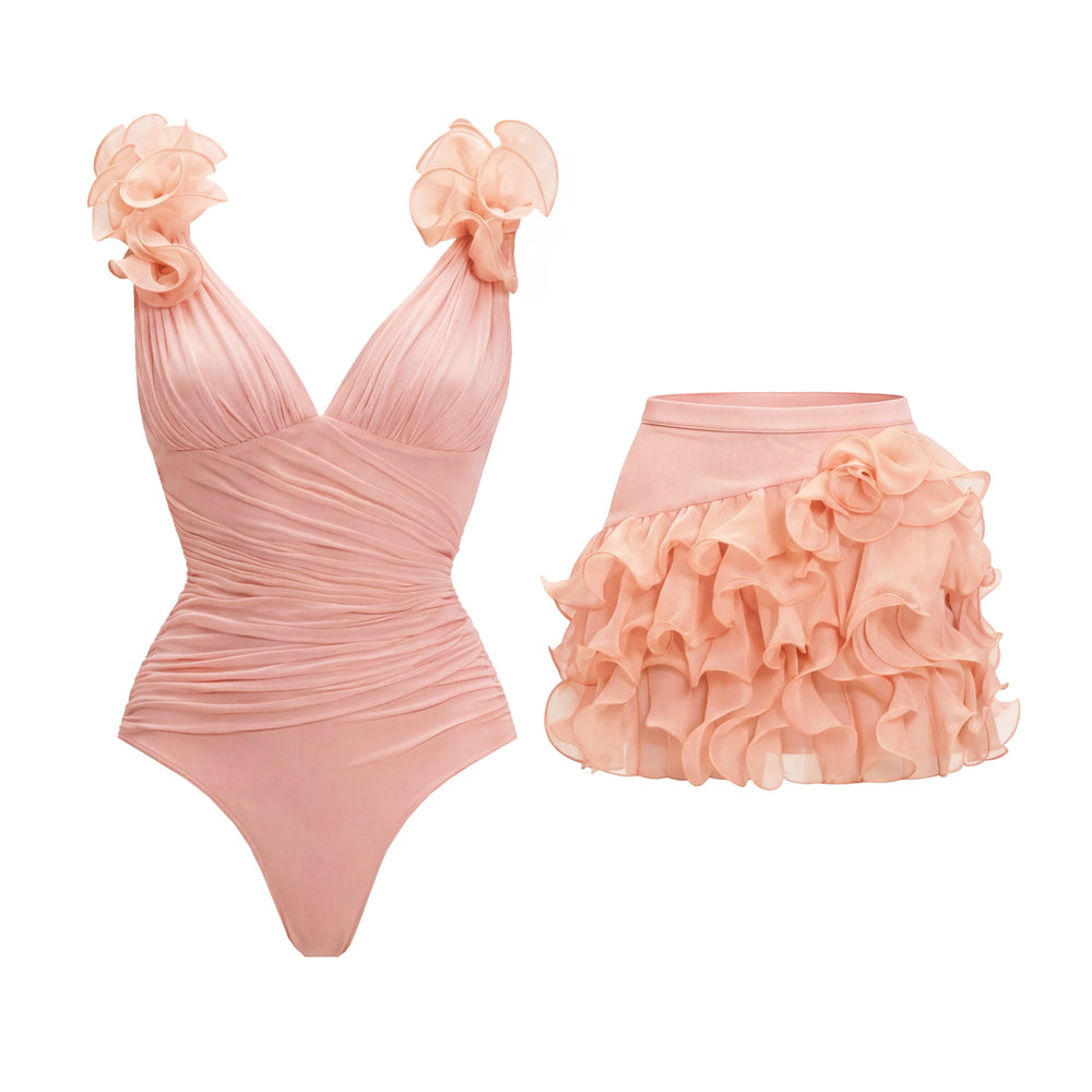 Ruched V-neck swimsuit with floral shoulder details and ruffled mini skirt