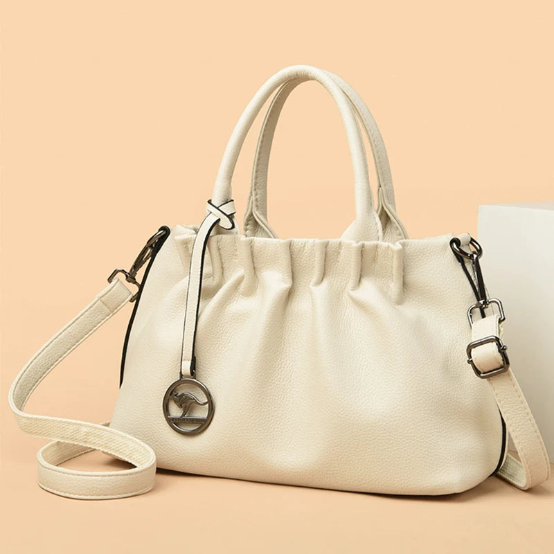  Golden Atelier women's crossbody bag in PU leather with pleated design and adjustable shoulder strap.Rice White