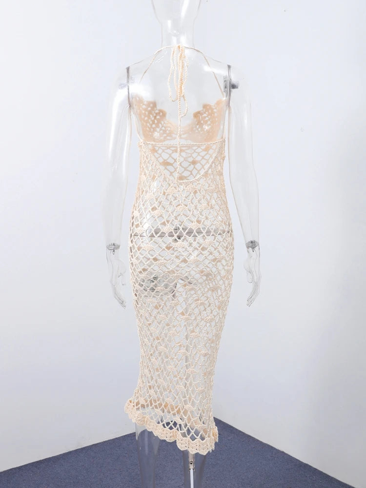 Beige lace dress on a mannequin against a white background
