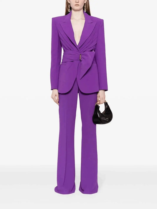 Purple belted blazer and flared trousers suit on model