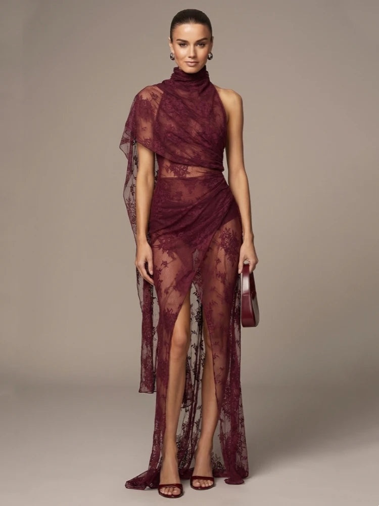 High neck draped lace maxi dress with model hand on chin