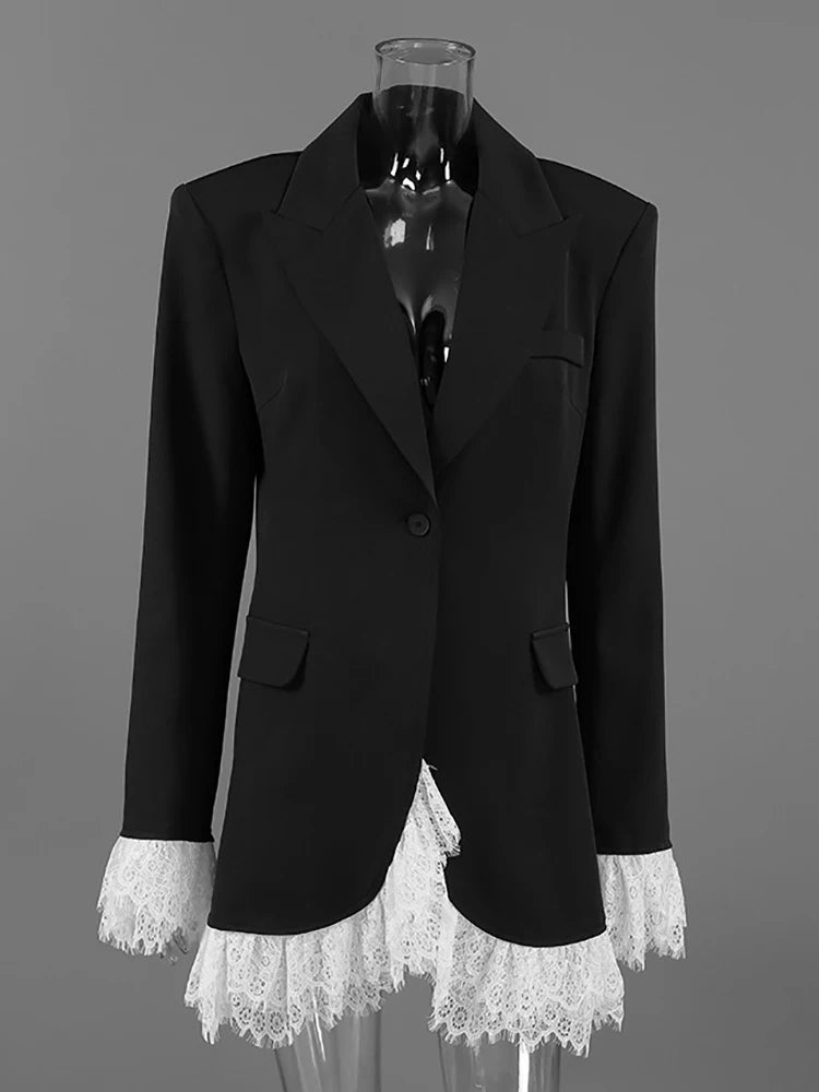 Black blazer with lace cuffs on a mannequin against a gray background