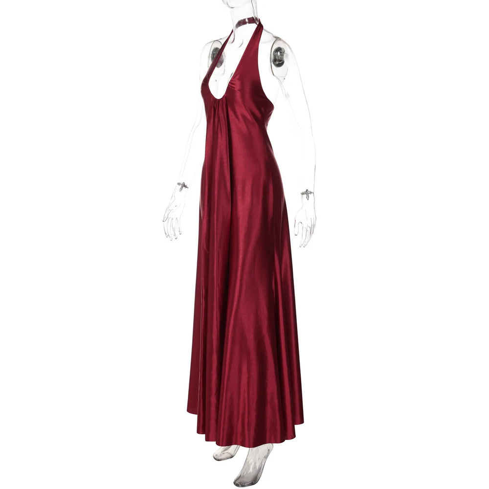 Red satin halter neck gown on a mannequin against a white background