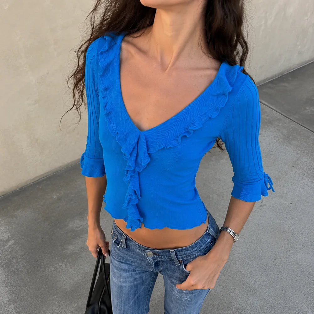Blue ruffled v-neck knit top with tie sleeves
