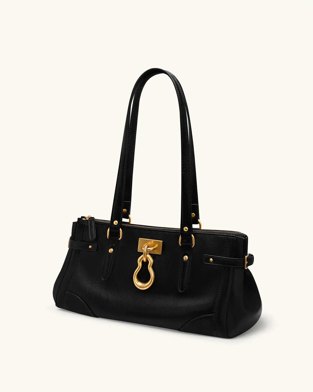 Black leather tote bag with gold lock detail, angled view