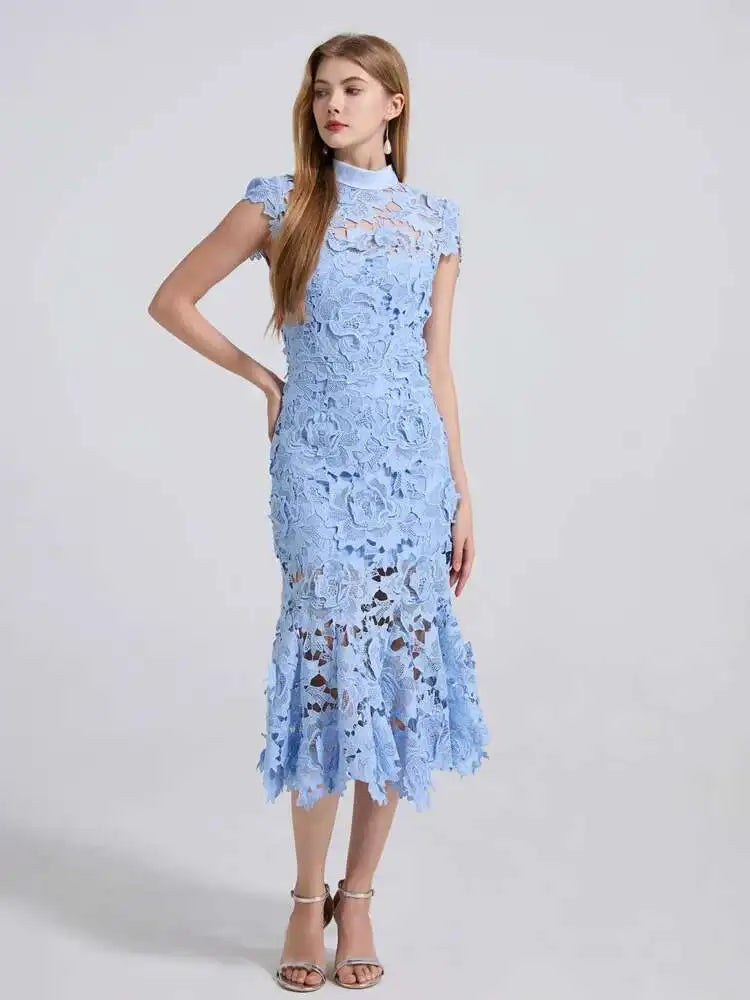 Woman wearing a light blue lace dress on a white background