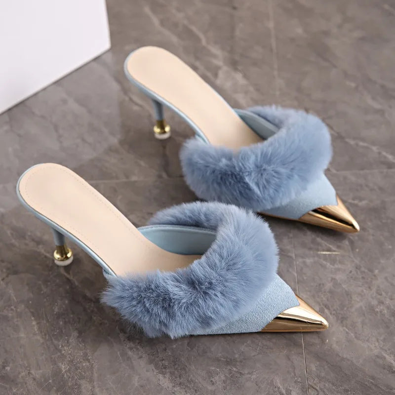 Blue faux fur trim pointed heel mules with metallic toe cap.