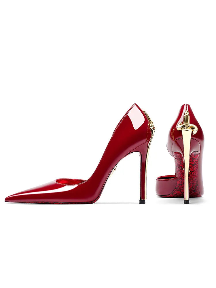 Red high-heeled shoes with gold accents on a white background