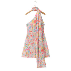 Colorful halter dress with floral pattern on a hanger against a white background