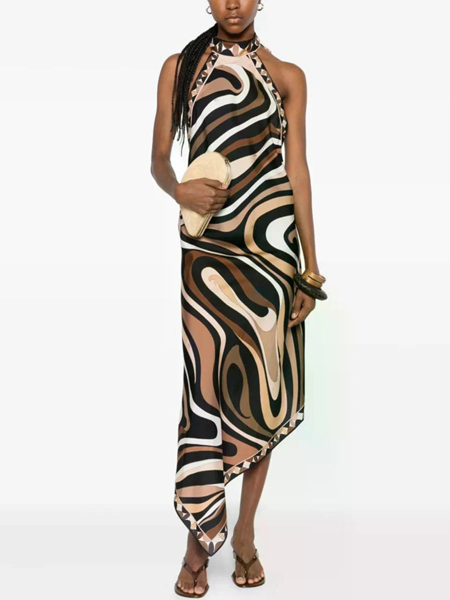 Halter neck abstract print maxi dress with asymmetrical hem on model