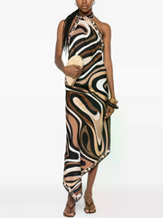 Halter neck abstract print maxi dress with asymmetrical hem on model
