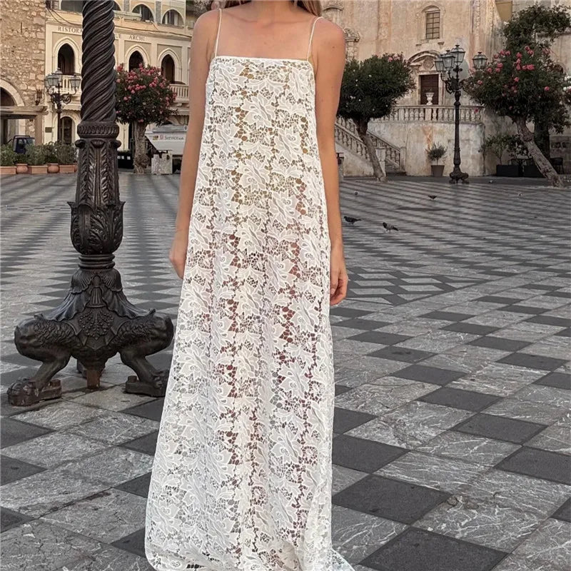 White floral lace spaghetti strap maxi dress in an outdoor plaza