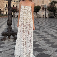 White floral lace spaghetti strap maxi dress in an outdoor plaza