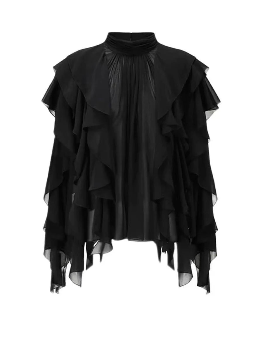 Black ruffled blouse on a white background