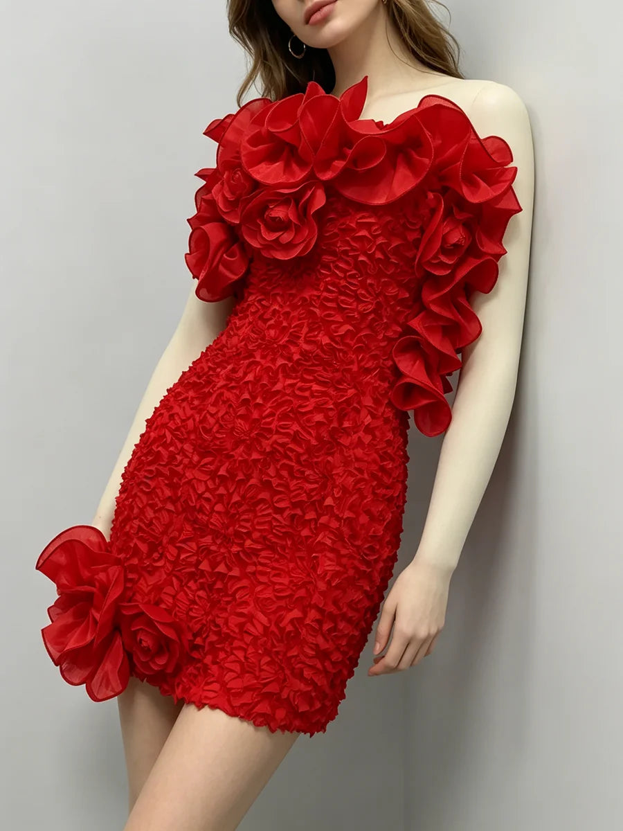 Strapless ruffled floral mini dress leaning against a wall