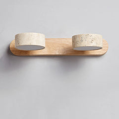 Wall-mounted light fixture with wooden base and stone-like lampshades on a gray background