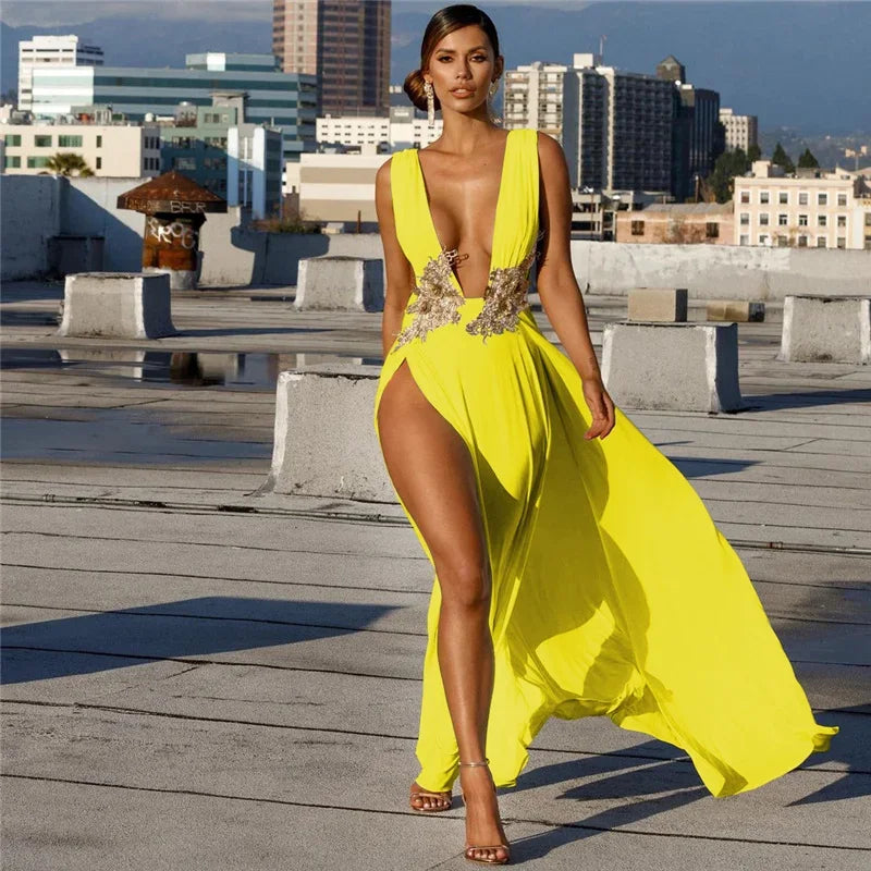 Woman in a bright yellow dress with a cityscape in the background