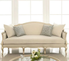 Formal living room centerpiece sofa with neutral beige upholstery