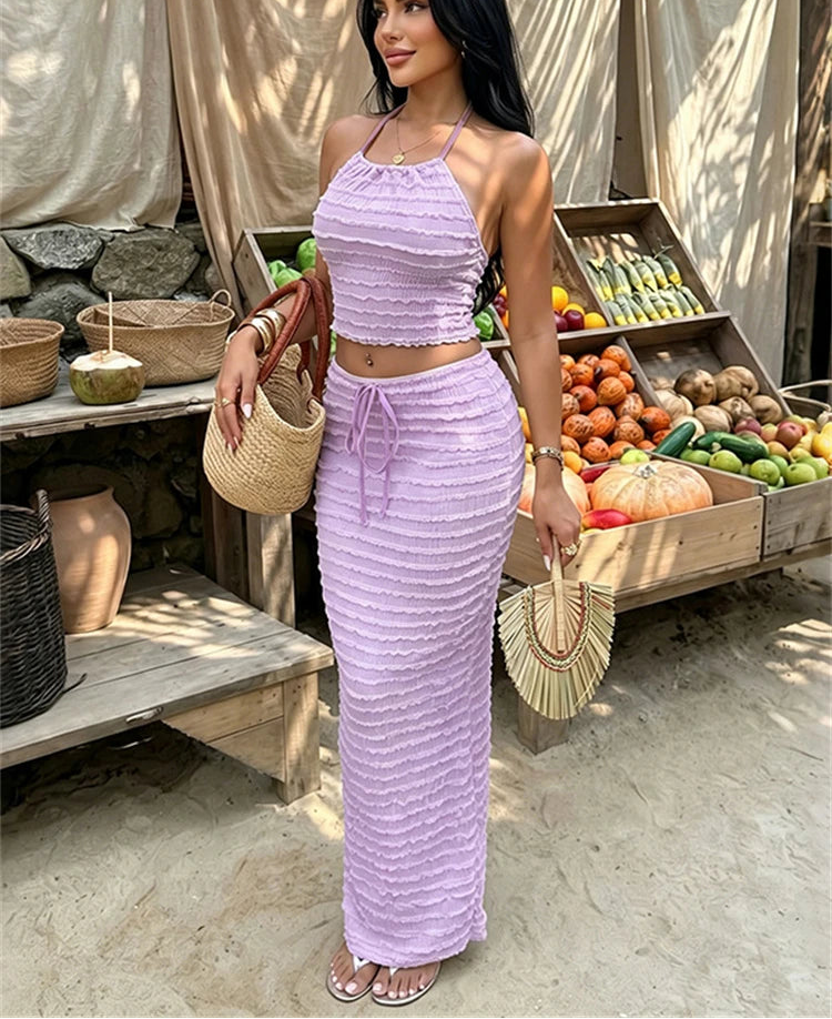Textured knit halter crop top and column skirt set in purple.