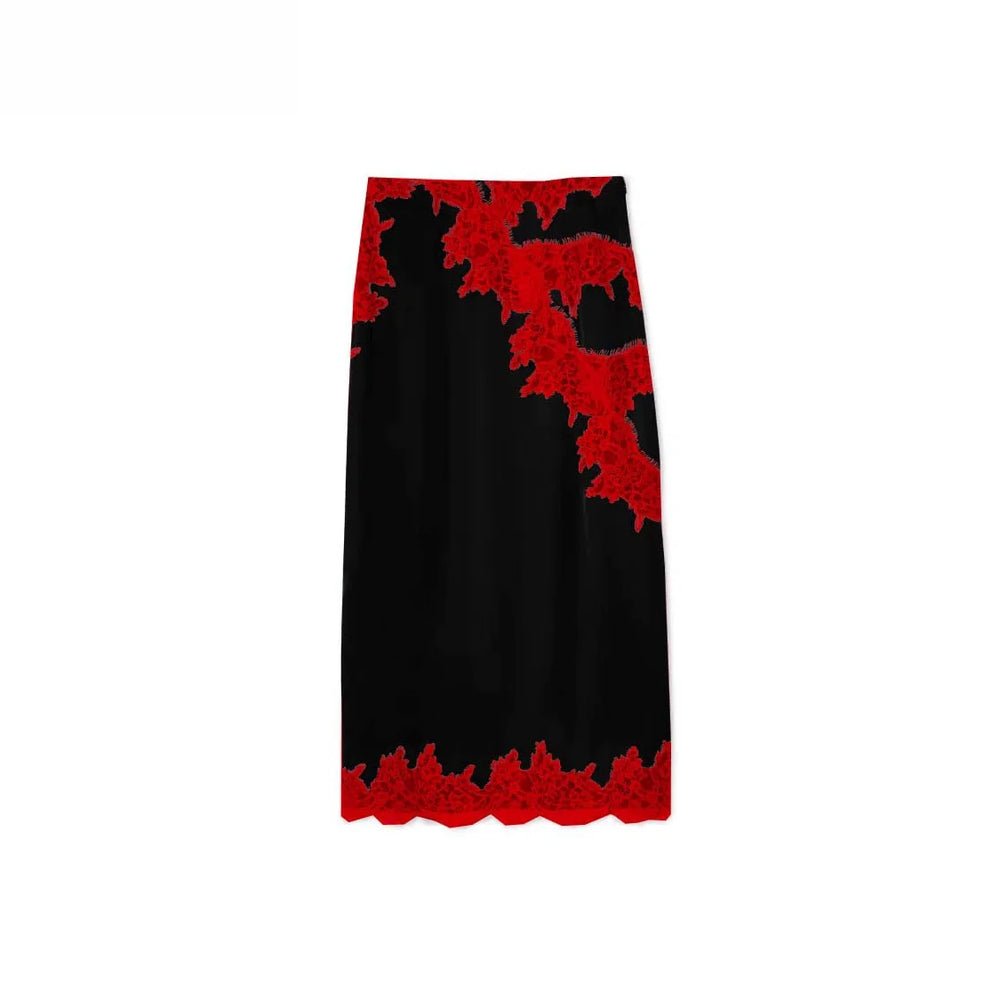 Black skirt with red lace trim on a white background