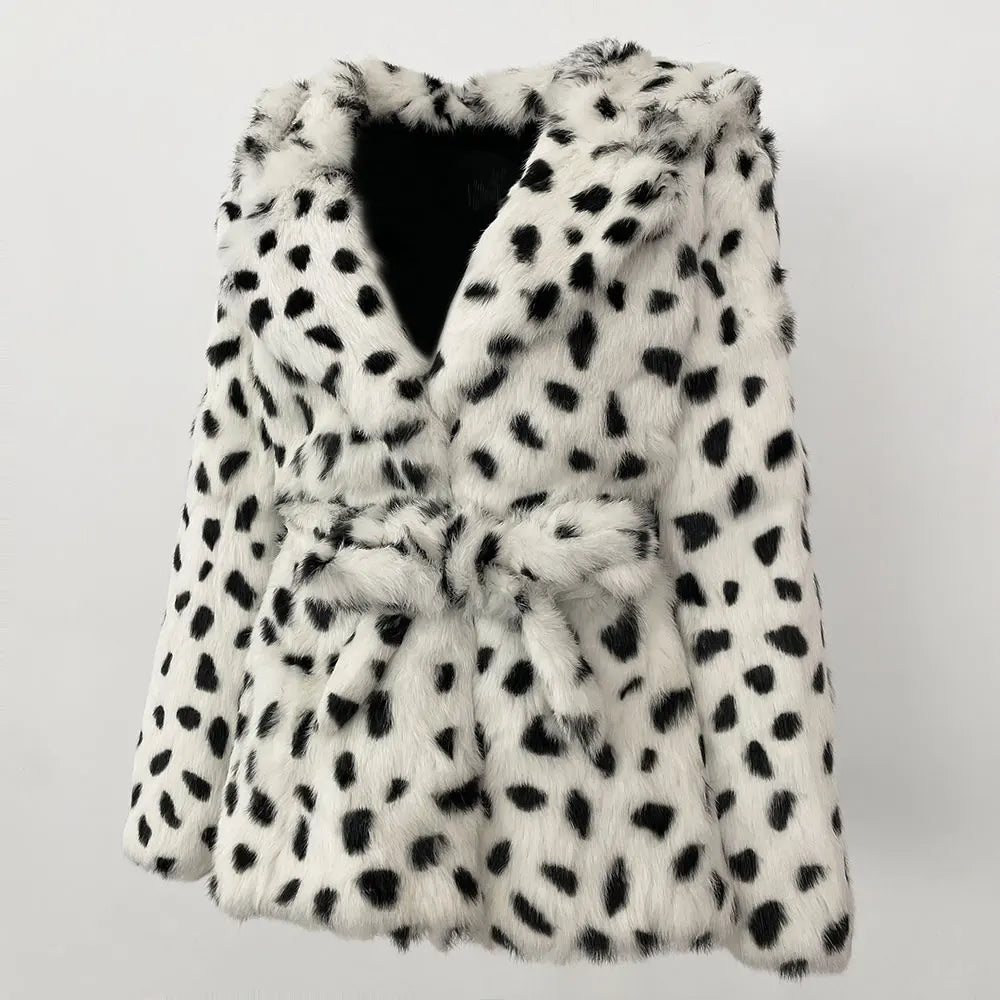 White fur coat with black spots on a light gray background