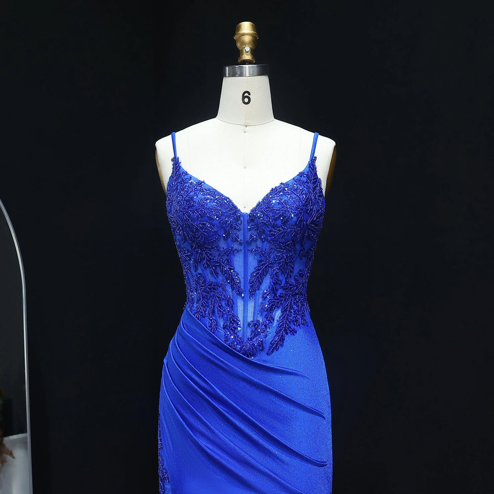 Blue evening gown on a mannequin against a black background