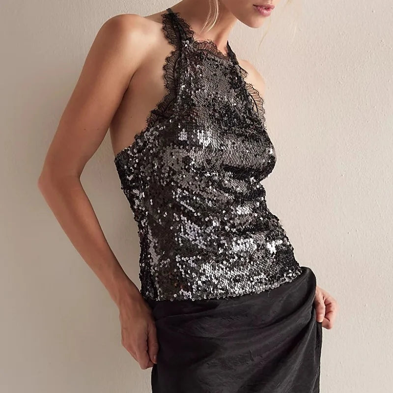 Black sequin halter neck top with lace trim and black skirt