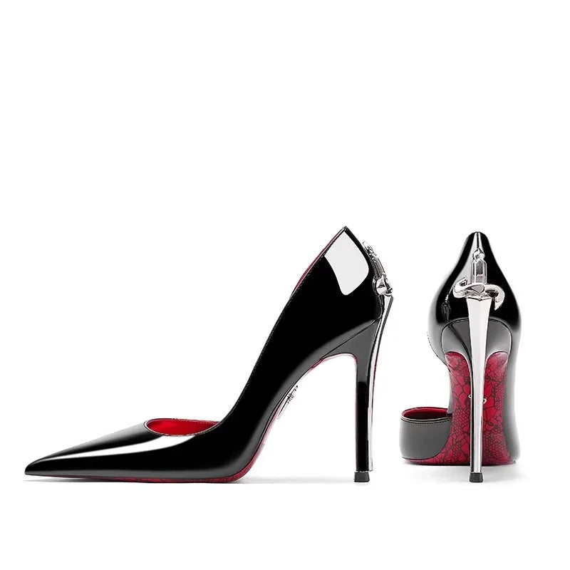 Black high-heeled shoes with red soles on a white background