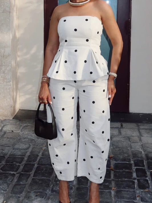 White polka dot strapless peplum top and high-waisted wide-leg pants set