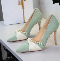 Light green pointed toe pumps with bow and pearl detail