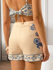 Beige and blue floral pajama set with matching top and shorts.