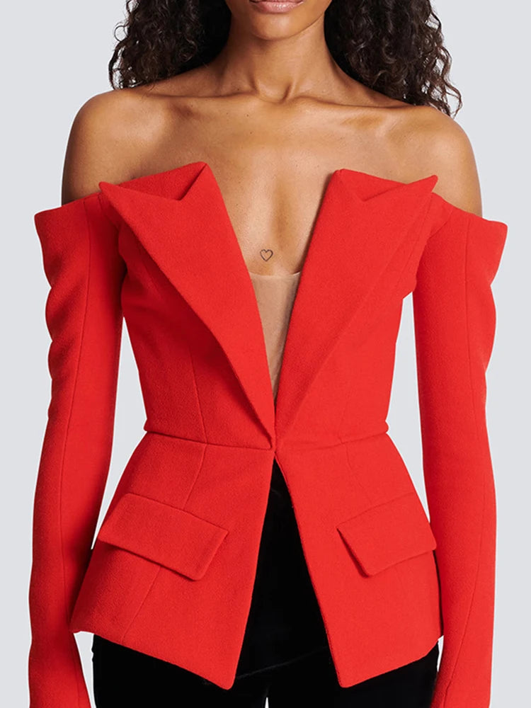 Red off-shoulder blazer worn by a model on a plain background
