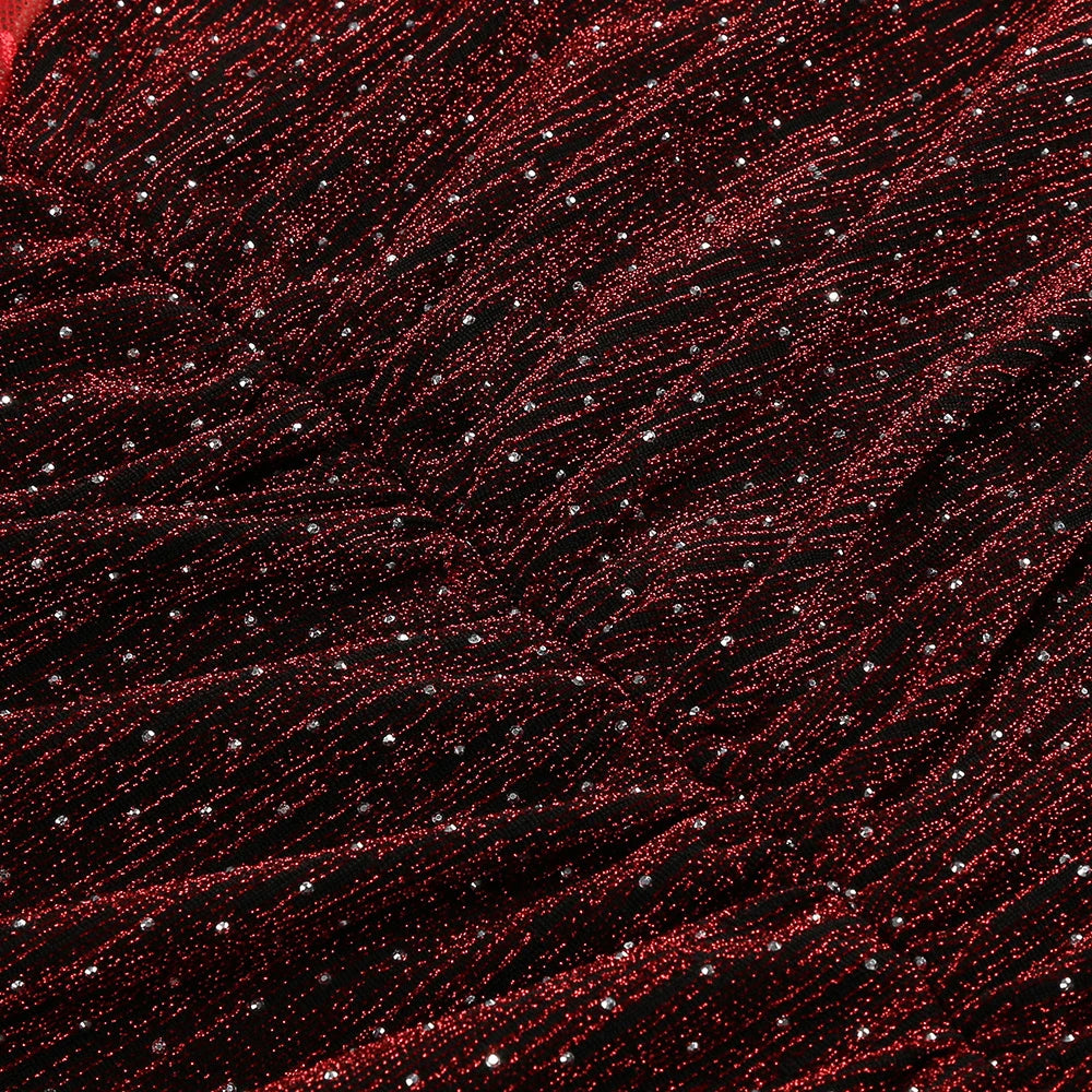 Close-up of red and black textured fabric with small white dots