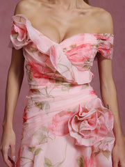 Pink floral off-shoulder dress on a pink background