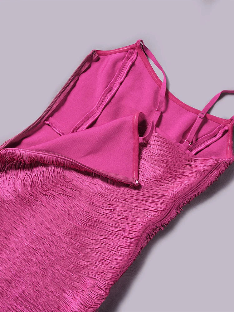 Pink fringed dress on a light gray background