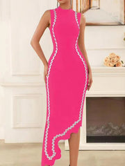 Woman wearing a bright pink dress with white trim in an elegant room.