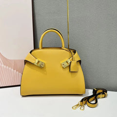 Yellow leather satchel bag with gold hardware