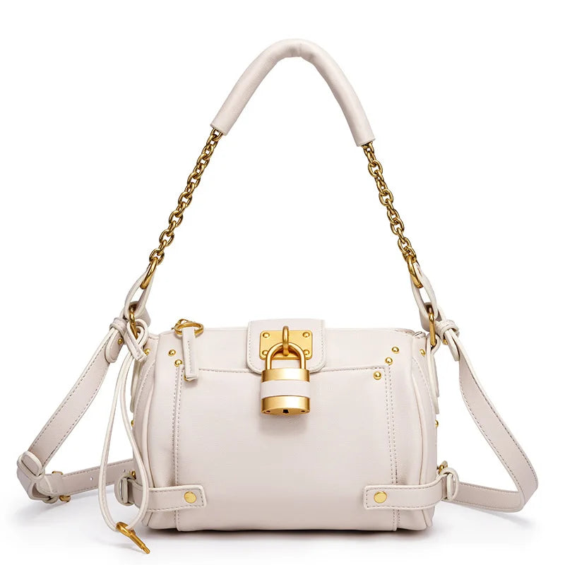 White structured leather bag with gold lock detail and chain strap