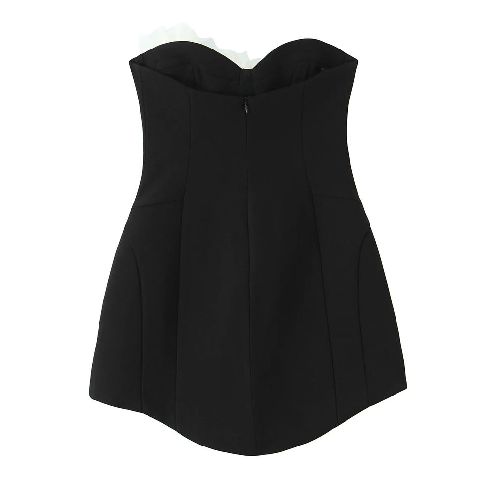 Black strapless top on a white background