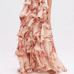 Long, ruffled dress with floral pattern on a white background