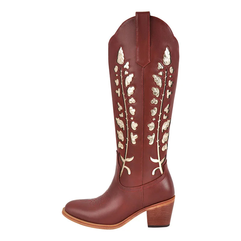 Brown cowboy boot with white floral patterns on a white background